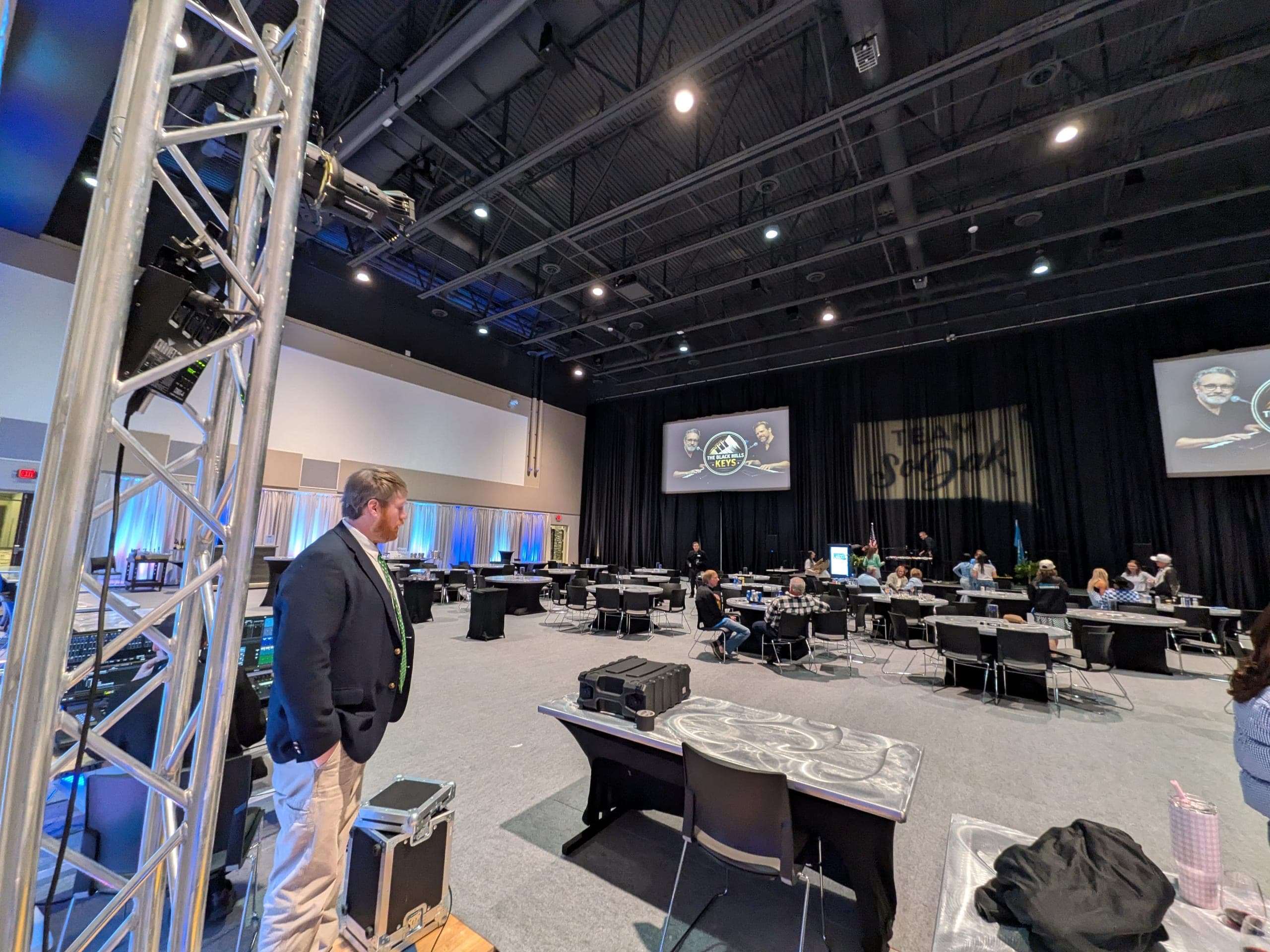 Brink Productions running audio, lighting, and twin projection screens for a corporate banquet in a Black Hills event hall